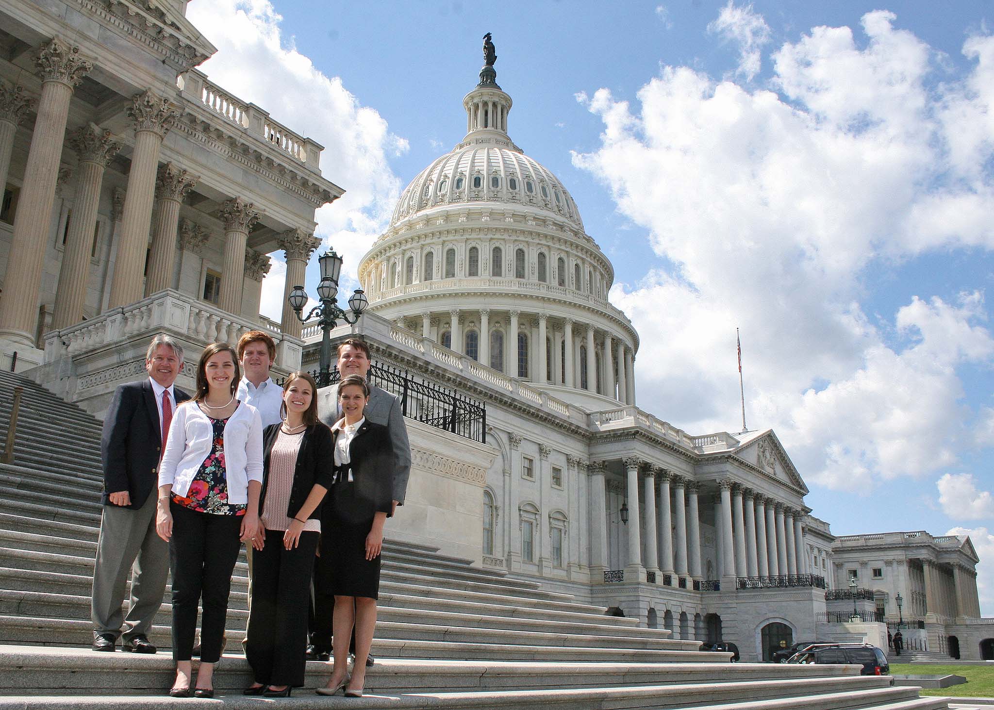 Associate Dean for Academics Josef Broder stands with CAES Agricultural D.C. Fellows Valerie Noles, Rebecca Rykard, Heather Hatzenbuhler, William Moses and Lee Lister at the capital during summer 2013.