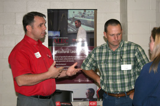 Jason Peake, an agriculture teacher at the University of Georgia Tifton Campus, talks to prospective students and family members at last week's showCAES Southeast recruiting event in Lyons on Sept. 19.
