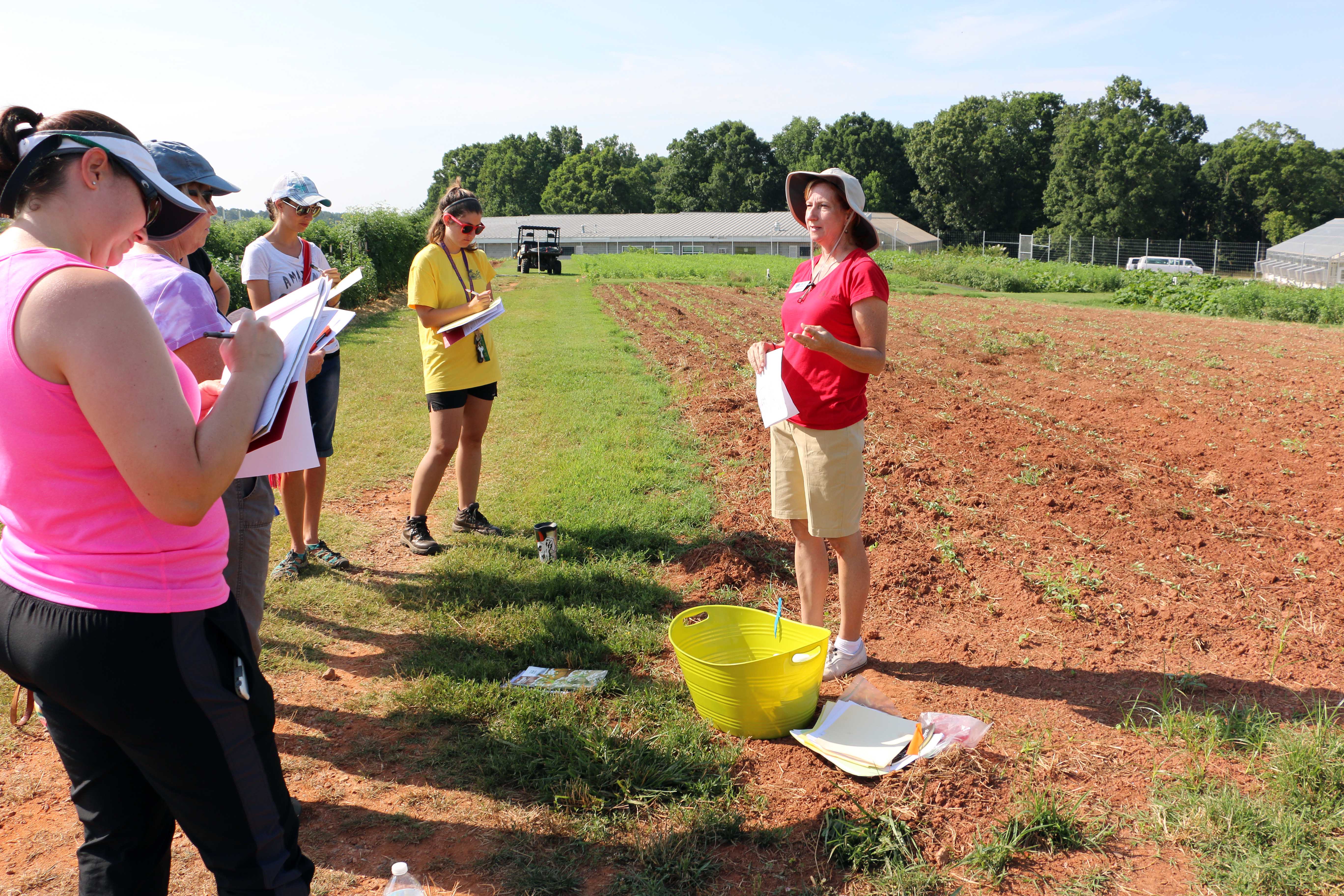 Becky Griffin, UGA Extension community and school garden coordinator, speaks to a group of teachers at a school garden curriculum training at UGArden in Athens, Georgia.