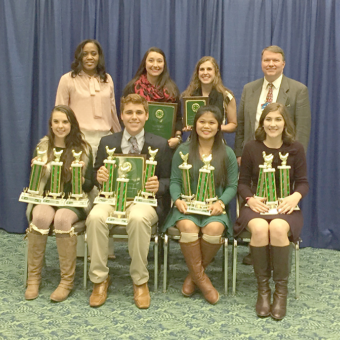 Members of the Tift County 4-H poultry judging team pose with their national championship plaques.
