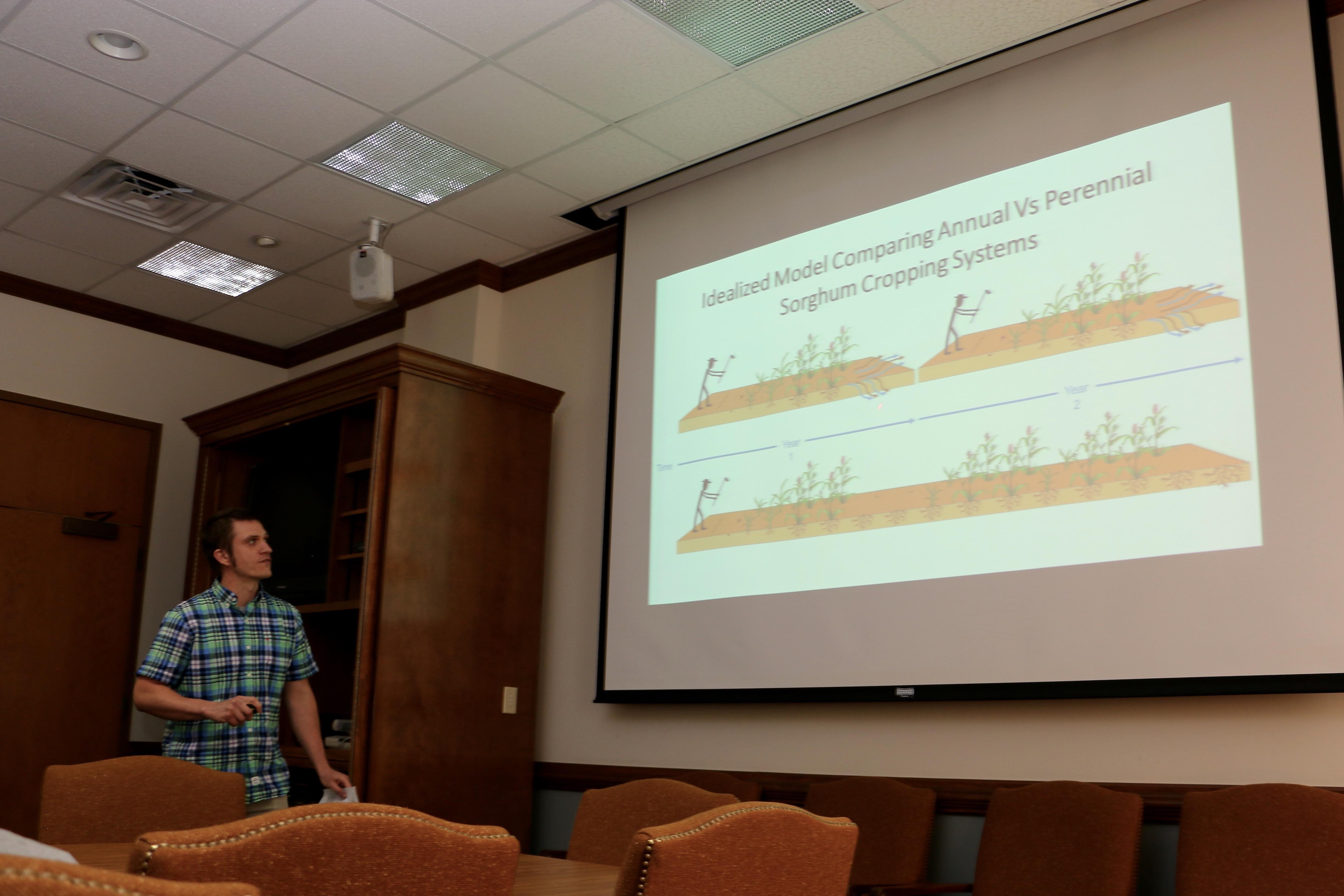 A graduate student from the second cohort of UGA's Sustainable Food System Initiative fellowship program presents his research at a year-end symposium in April.