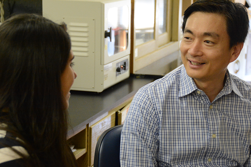 Woo Kyun Kim, assistant professor of poultry science at the University of Georgia, discusses upcoming research projects with graduate student Fernanda Castro.