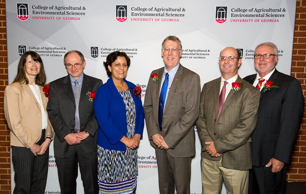 College of Agricultural and Environmental Sciences Dean and Director Sam Pardue (center) congratulates recipients of the CAES D.W. Brooks Awards Nov. 7. This year's winners include, from left, Professor Katrien Devos, Professor Ignacy Misztal, Professor Maria Navarro, UGA Extension Agriculture and Natural Resources Program Coordinator Wade Parker and Calvin Perry, superintendent of UGA's C.M. Stripling Irrigation Research Park.