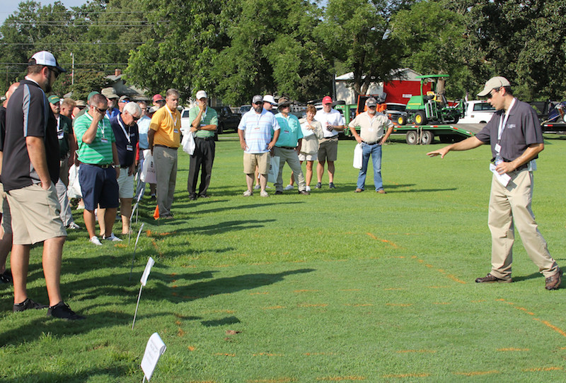 Patrick McCullough, UGA Extension weed specialist, was among the scientists who shared their findings at the UGA Turfgrass Research Field Day held on Thursday, Aug. 9, 2018. McCullough is shown telling visitors the results of his study on bluegrass control in Bermuda grass.