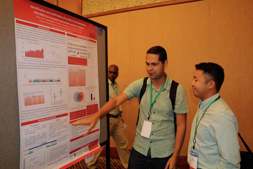 UGA graduate student Renan Souza presents his poster to one of the judges. More than 100 graduate students attended the 2019 National Association of Plant Breeders meeting.