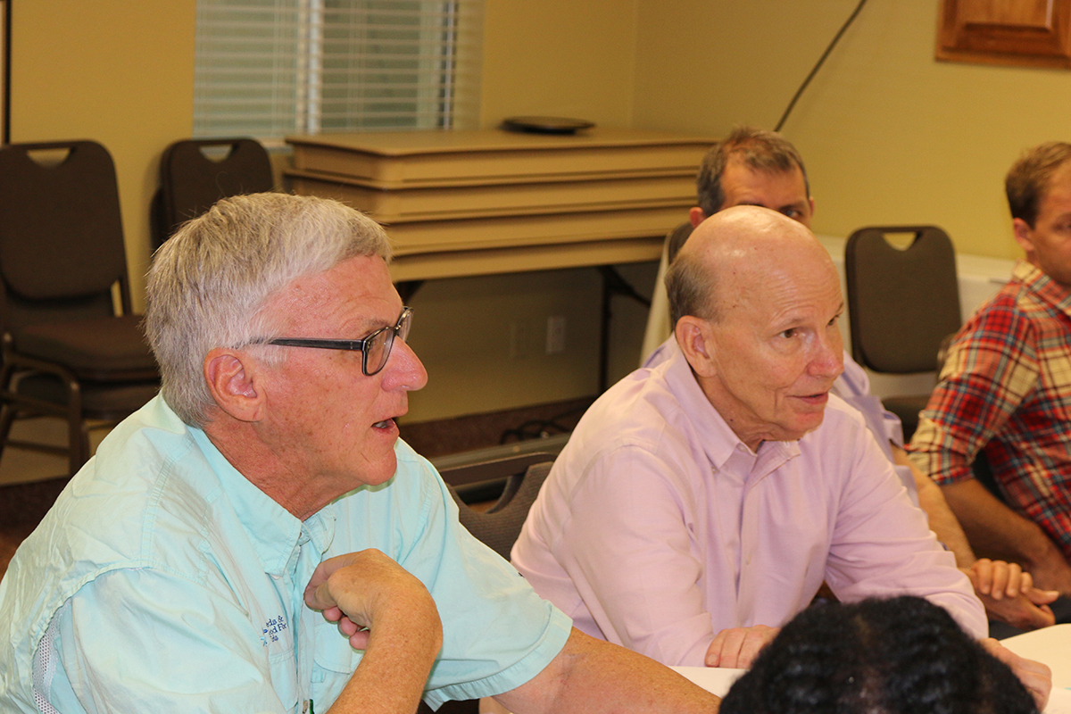 Steve Brown (left), executive director of the Peanut Research Foundation, and Jeff Johnson, a retired Birdsong Peanuts executive who serves on the Peanut Innovation Lab’s External Advisory Panel, discuss project proposals as the lab started a new five-year program in 2018. (Photo by Allison Floyd)