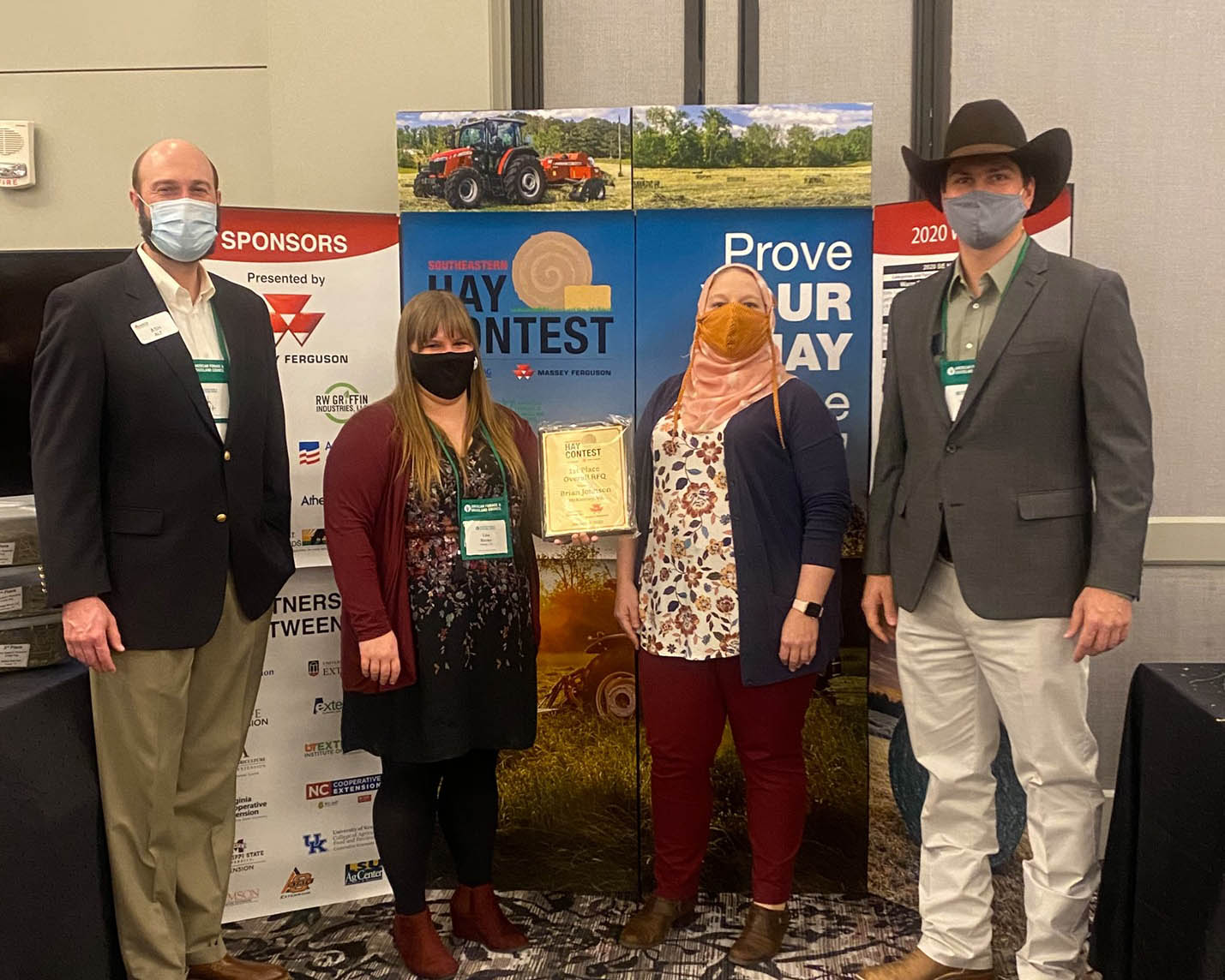 The 2020 Southeastern Hay Contest grand prize was awarded to Brian Johnson of McKenney, Virginia, for his alfalfa hay sample (not pictured). Pictured from left to right are Ash Alt, Massey Ferguson Field Execution Manager; Lisa Baxter, UGA Forage Extension Specialist; Leanne Dillard, Auburn University Forage Extension Specialist; and Marcelo Wallau, UF Forage Extension Specialist.