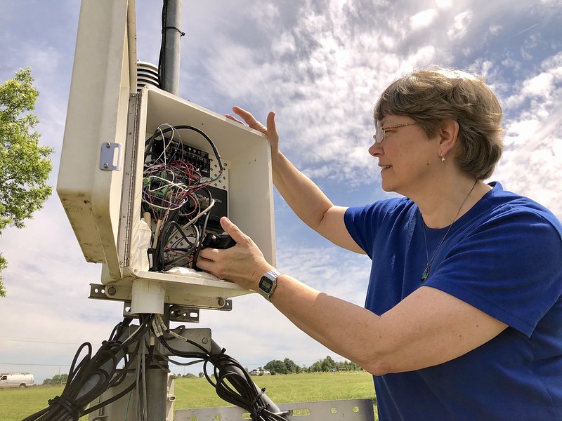 UGA Weather Network Director Pam Knox checks one of the data-logger boxes maintained by the network. All of the observational instruments connect to the data-logger, which collects and transmits weather data at 15-minute intervals, which is then disseminated through the UGA Weather Network website.