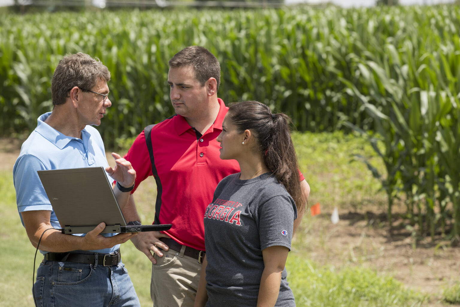 George Vellidis, a professor in the department of crop and soil sciences and University Professor, reviews surface water runoff data with students at the UGA Tifton campus. (Photo by Andrew Davis Tucker/UGA)