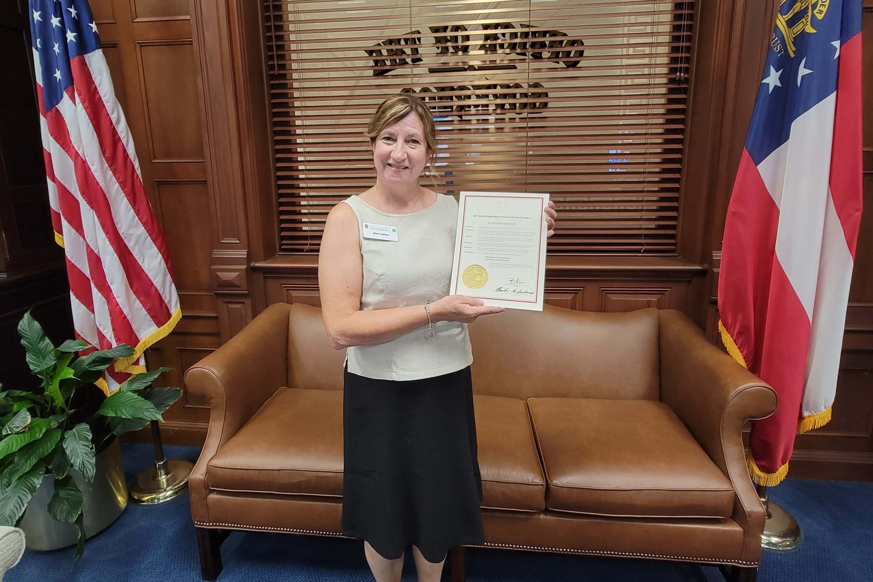 UGA Extension coordinator and census creator Becky Griffin holds a commendation from Georgia Gov. Brian Kemp honoring the Great Southeast Pollinator Census citizen-science initiative, which is in its fifth year.