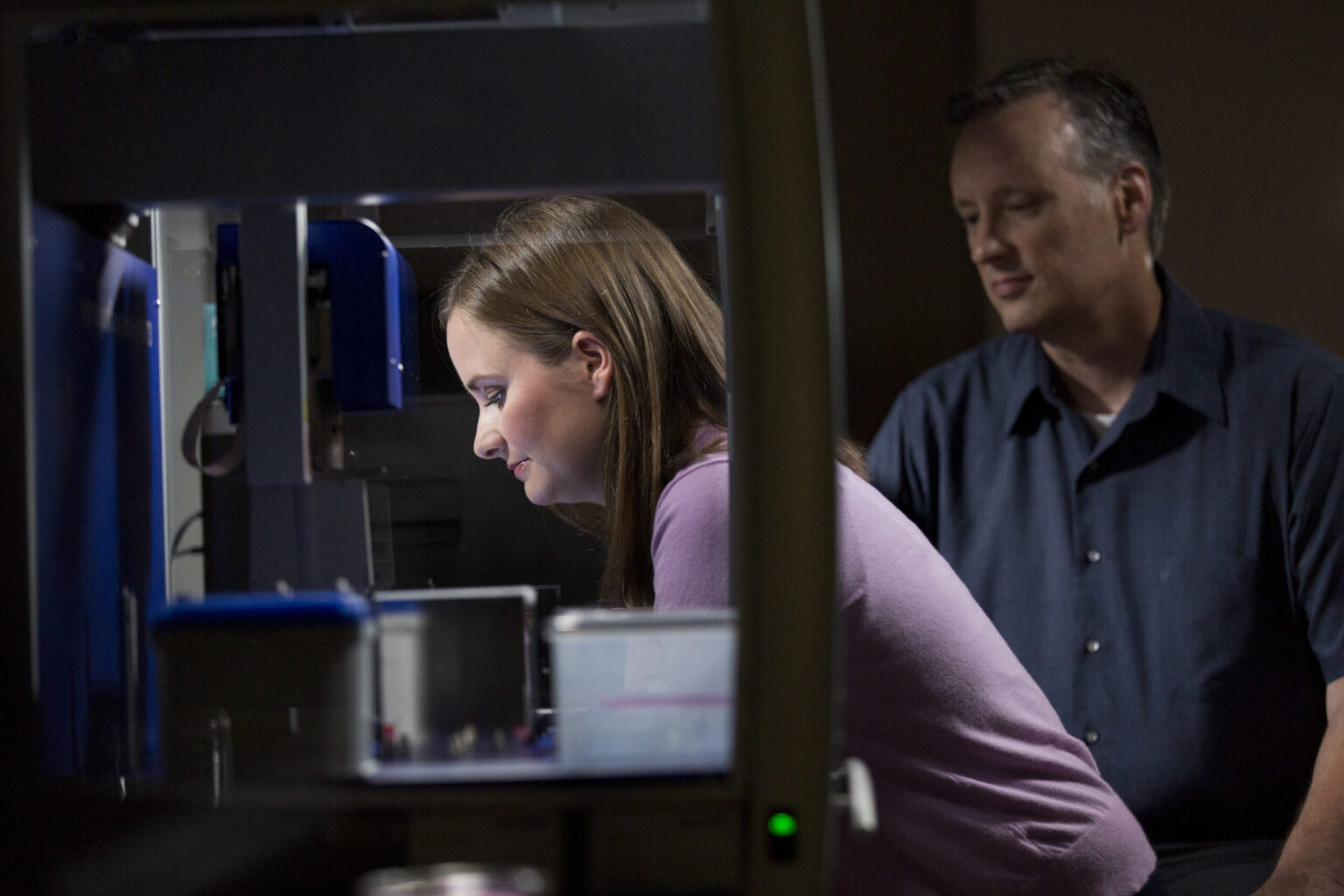Emily Baker, a former West Lab UGA Ph.D. graduate student, now serving as the director of nonclinical research at Aruna Biomedical, seen here working in the lab with Steven Stice, the director of the RBC and co-founder of Aruna Biomedical. The team is working on clearance from the FDA for the first-in-human stroke clinical trial using exosome technology. (Andrew Davis Tucker/UGA)
