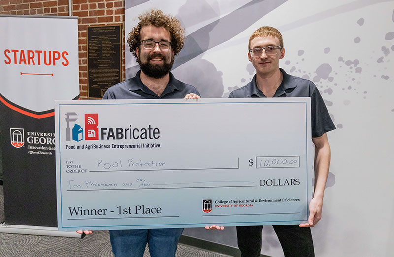 UGA College of Engineering students Garrett Stigall and Guy Gober won the 2024 FABricate entrepreneurial contest with their company, Pool Protection Technologies, and its high-quality Sound Amplifying Machine (SAM) that treats algae growth in pools. Photo by Sean Montgomery.