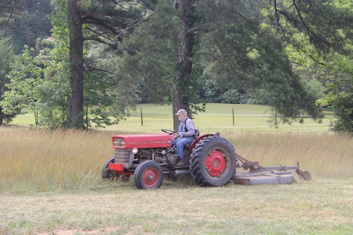 A farmer uses his tractor to bushhog a pasture in Butts County, Ga.