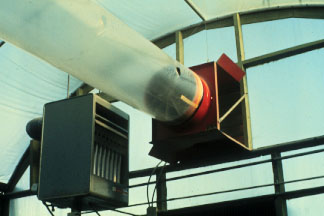 Forced-air heater and fan-jet air distribution system in a greenhouse