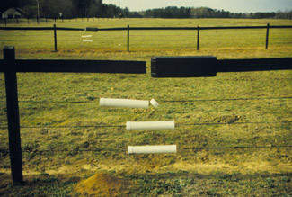 Example of a high-tensile fence with top rail