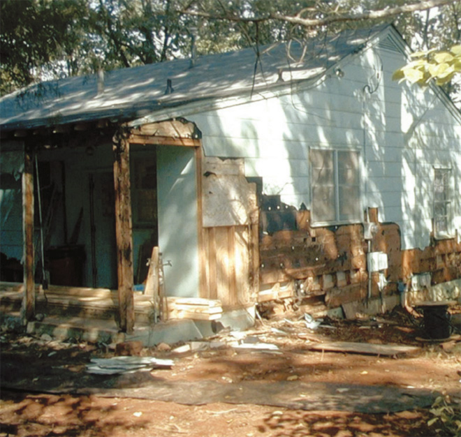 termite damage on the siding of a house