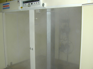 Electrostatic spraying of sanitizer in a hatching cabinet.