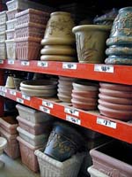 Decorative planting containers on shelves