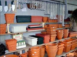 Planting containers on shelves