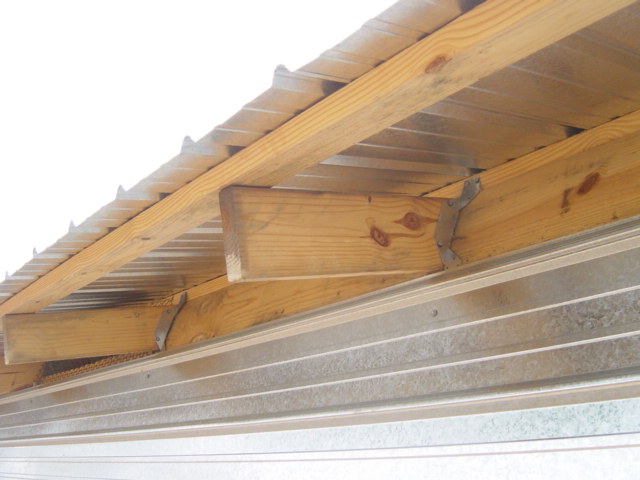 Trusses tied to the top of a wall using “hurricane straps