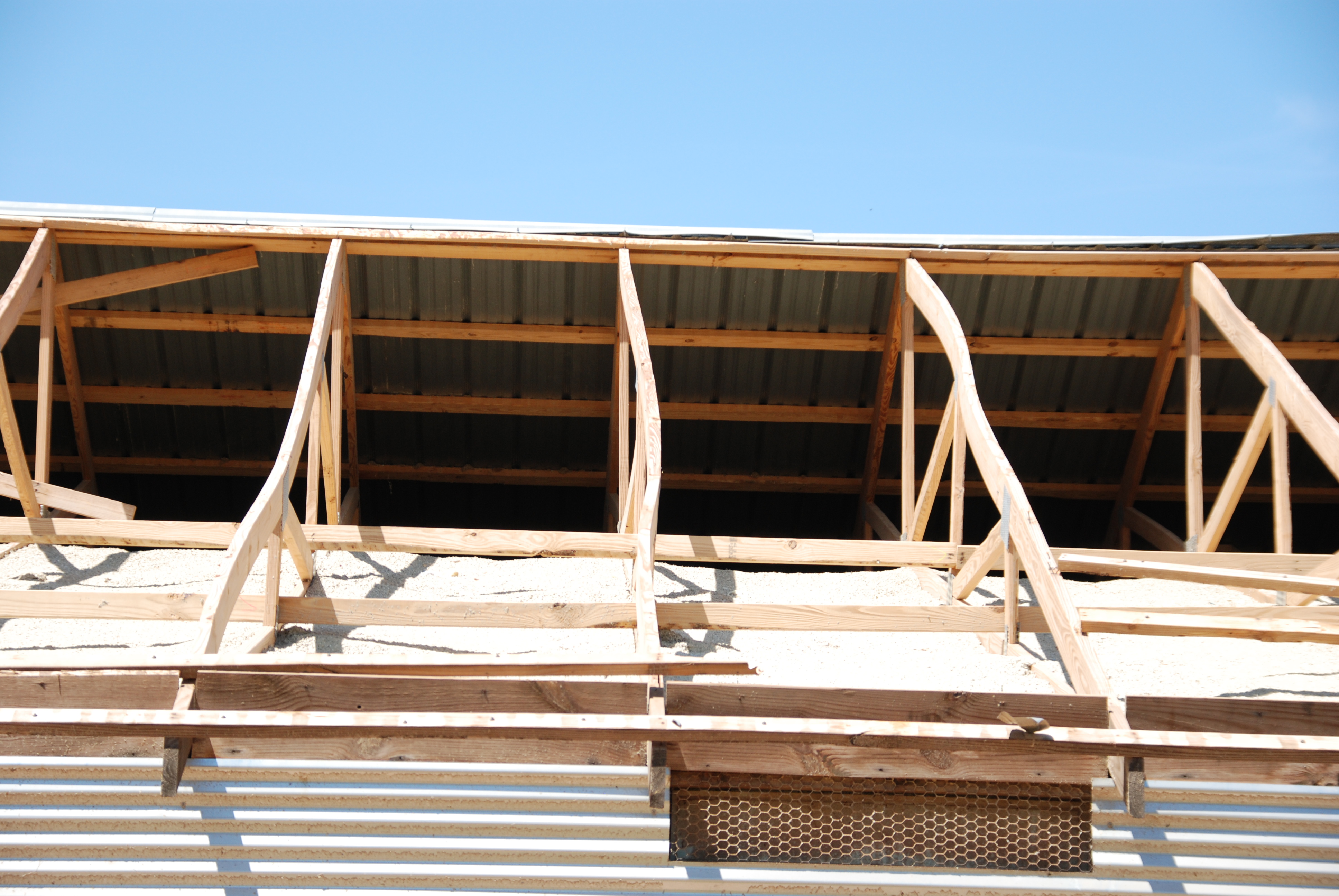 Figure 25. Bracing of trusses is essential to keep trusses vertical and to help carry loads along the length of the house