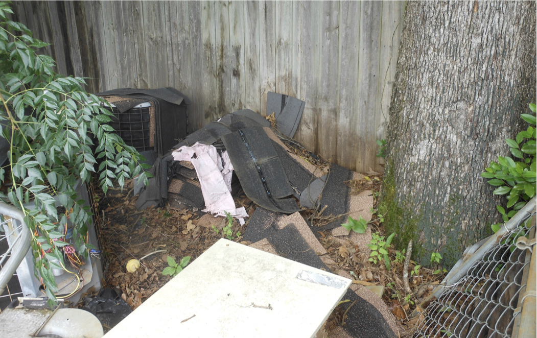 Asphalt roof shingles in a yard