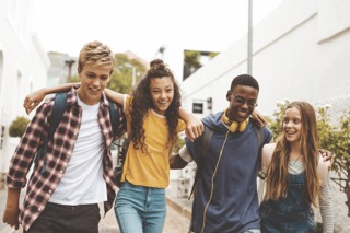 Four students walking