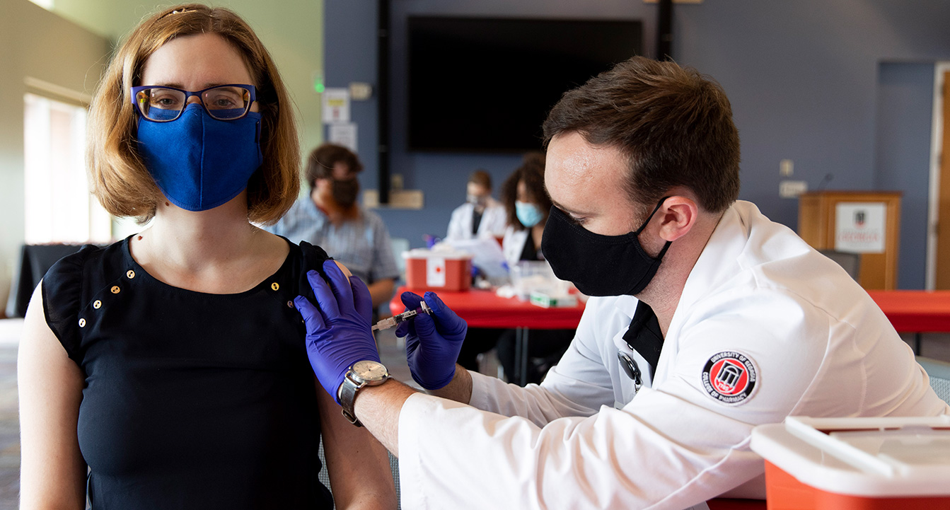 Lady getting a vaccine