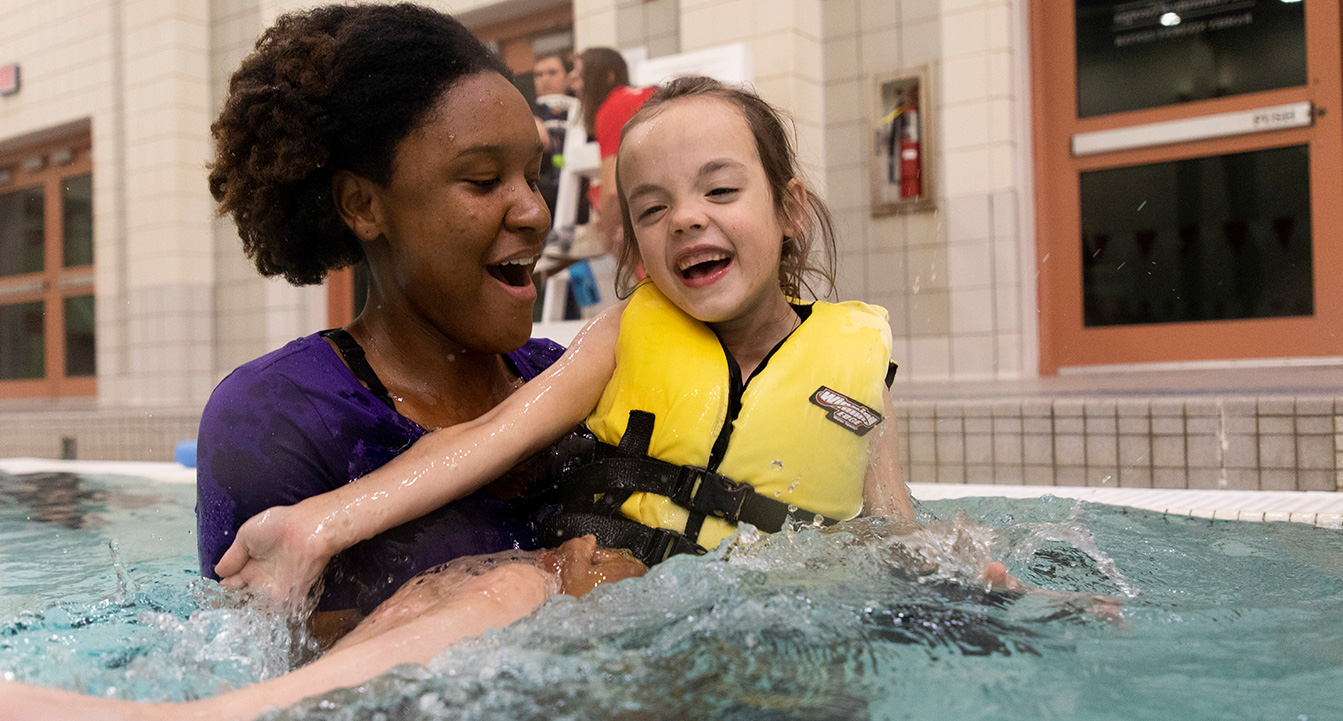 Woman and child in pool