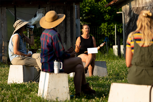 People sitting on blocks in a circle