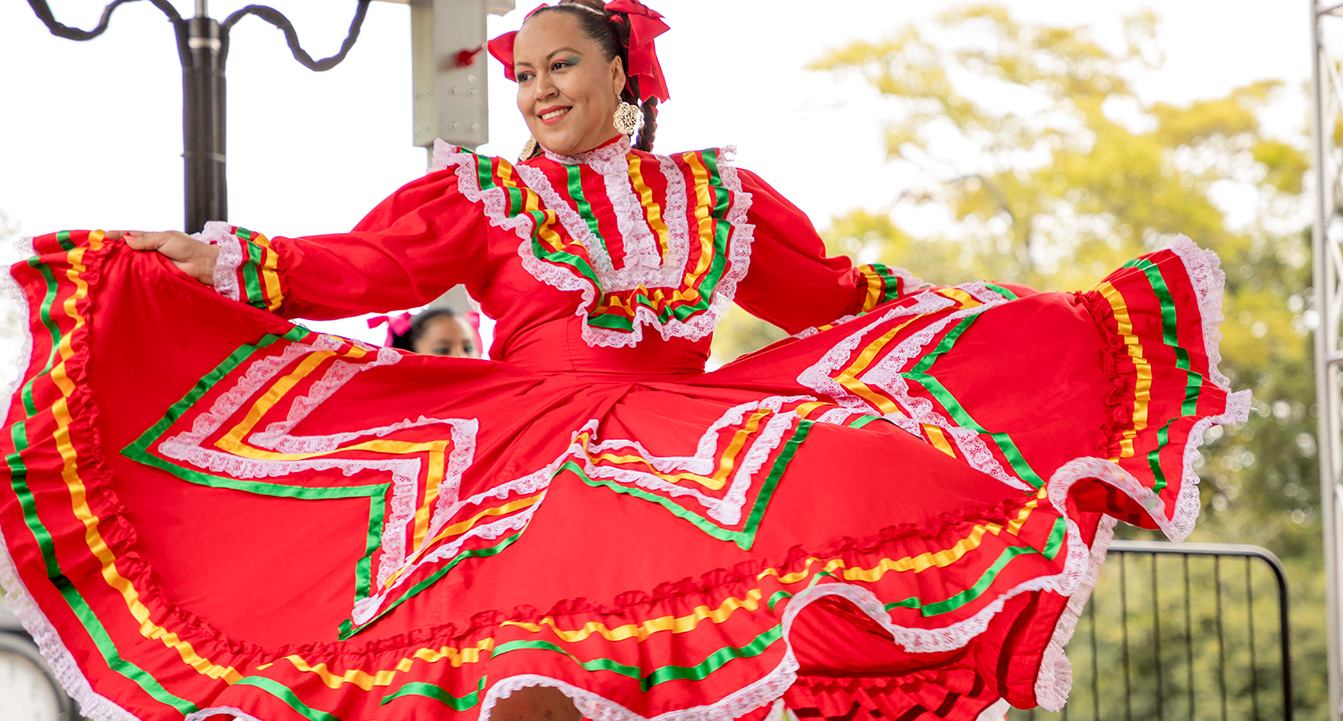 Woman dancing in extravagant dress