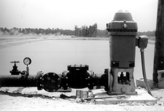 photo of a large agricultural well with electric motor.