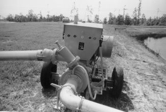 Photo of a iesel powered pumping unit on pond.