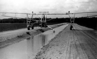 photo of ditch-fed linear move irrigation system.