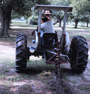 Figure 14. Installing lateral line using subsoil plow.