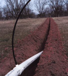 Figure 4. Installing PVC mainline.