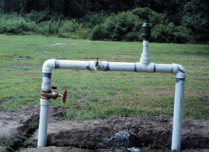 Figure 8. Control station with manual on-off valve (left valve), injection port (center valve) and kinetic air relief valve (right valve).