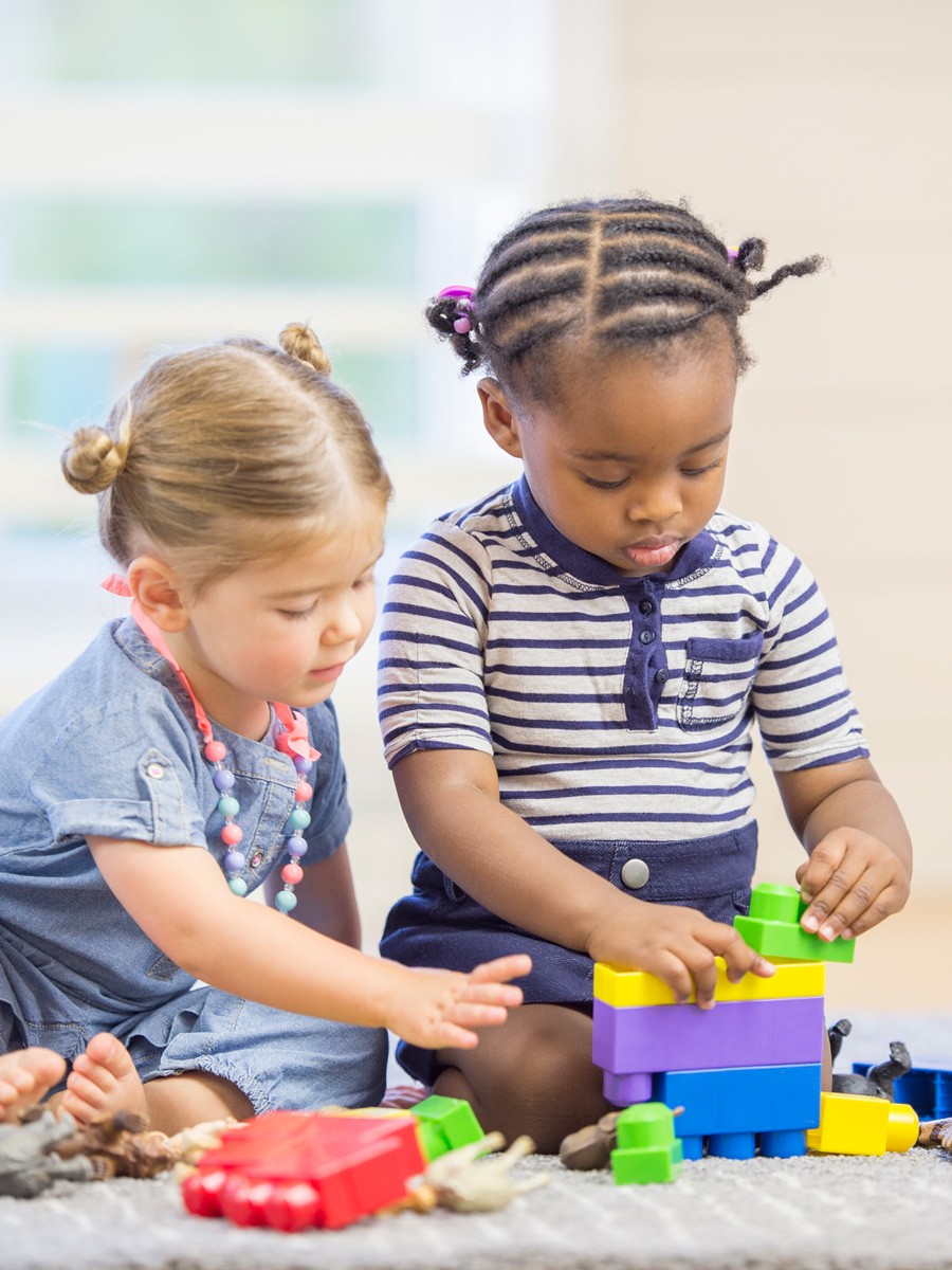 Stock photo of toddler playing with a toy