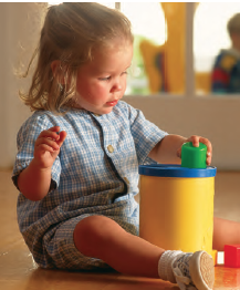 girl toddler playing with toy (stock photo)