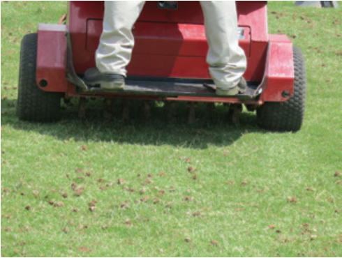 core aerator machine on grass