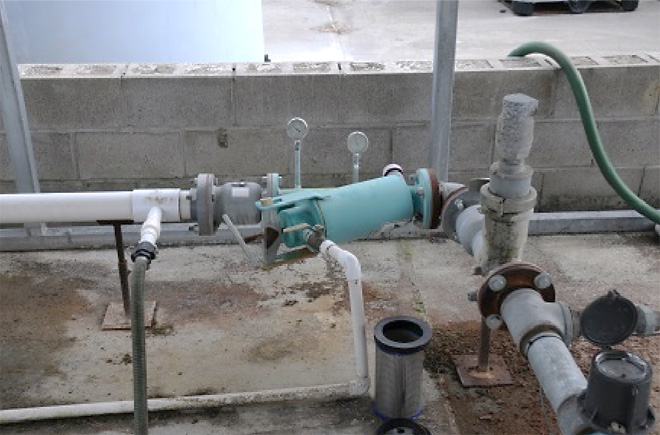 Filter, gauges, and air relief valve with a flow meter in the background.