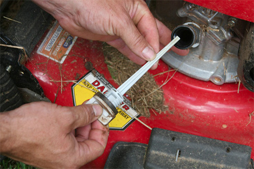 Checking engine oil using oil dip stick