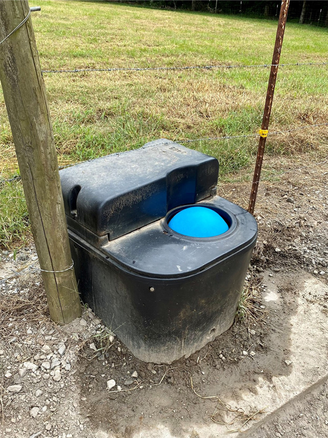 A closed-ball watering system for cattle.
