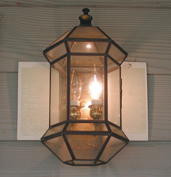 Outdoor light with glue traps on either side.