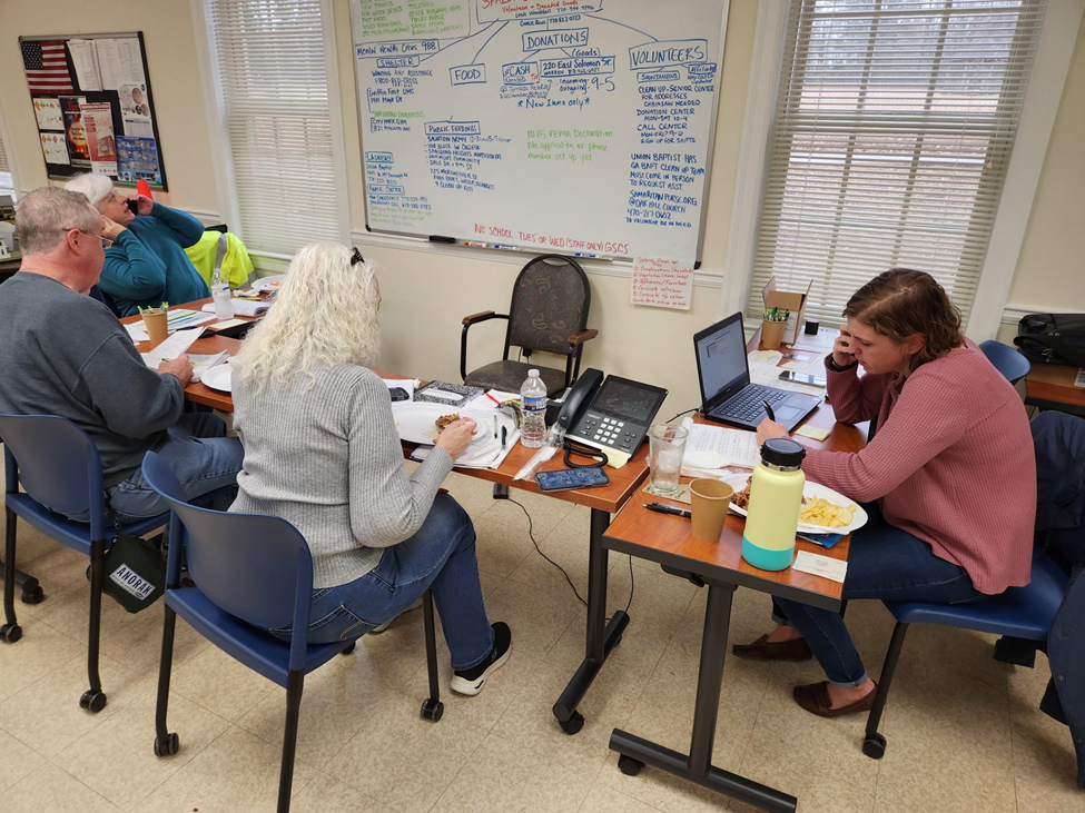 Spalding County Extension staff and volunteers assist residents vis the Tornado Relief Hotline.