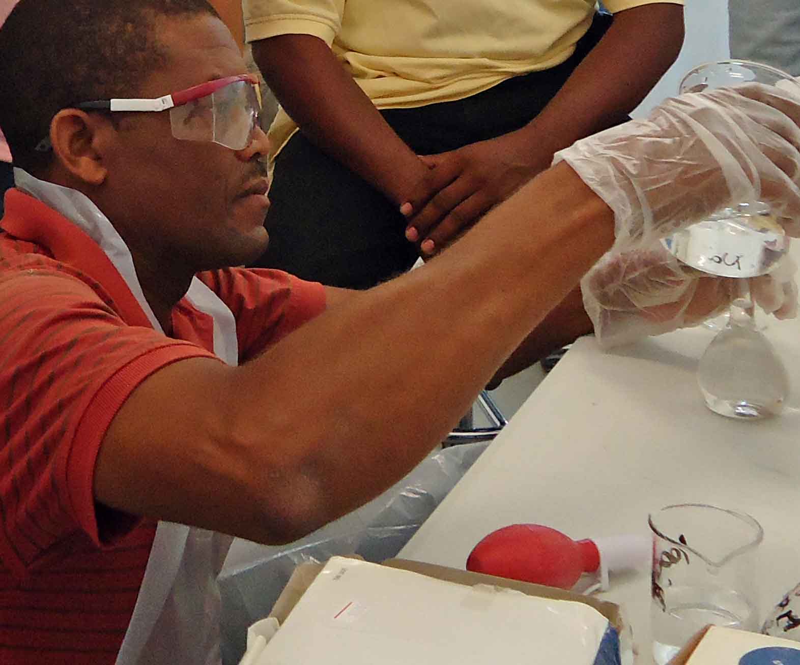 Leticia Sonon, coordinator of the University of Georgia Extension Soil, Plant and Water Analysis Laboratory, teaches a group of Haitian teachers and school officials to use the soil-testing lab equipment that they recently delivered to the country. 
Sonon, and Agricultural and Environmental Services Laboratory director David Kissel, spent about a year design the lab, which is compact, durable and inexpensive to operate.