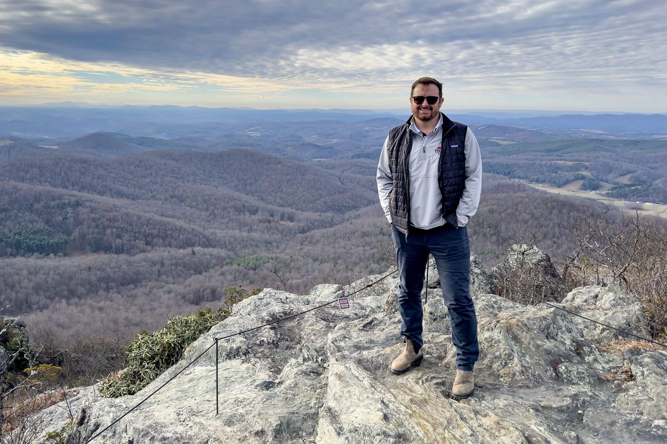 Travis Voyles stands at the summit of Buffalo Mountain Natural Area Preserve, an expanse of 1,146 protected acres in Floyd County, Virginia. The preserve received a $10 million expansion to add 1,000 acres this year.