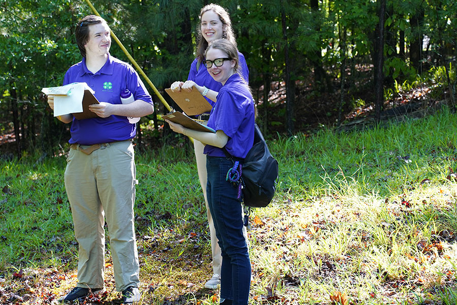Bleckley County 4-H'ers (left to right) Benjamin Agnew, Rebekah Crosby and Maggie Powell work together on the team assessment portion of 4-H Wildlife Judging.