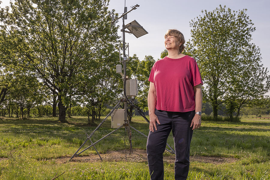 Agricultural climatologist Pam Knox monitors the effects of climate change on agiruclture throughout the U.S. Here, she checks a weather monitoring system at Durham Horticulture Farm in Watkinsville, Georgia.