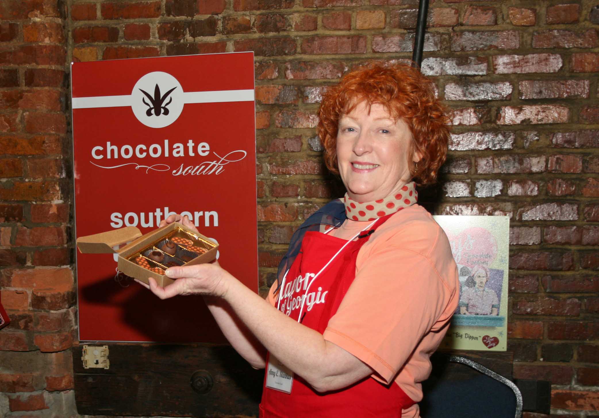 Atlanta architect and chocolatier Amy Stankus serves chocolates to the public during the Flavor of Georgia 2013 legislative reception on Monday March 11 at the Georgia Freight Depot in Atlanta. Stankus' company Chocolate South won the first prize in the 2013 Flavor of Georgia Food Product Contest.